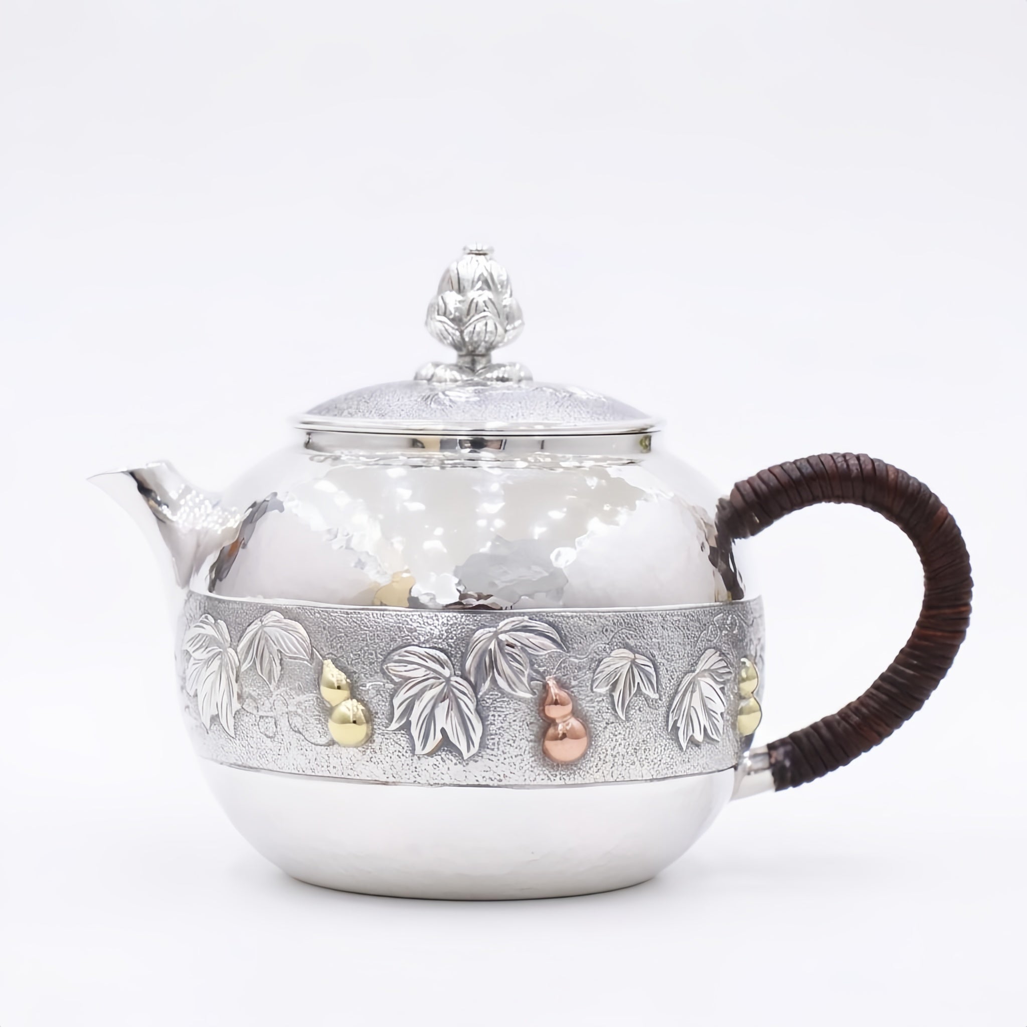 Pure 999 Fine Silver Handcrafted Silver Teapot with Embossed Leaf and Gourd Motifs and Woven Handle - Handicraft