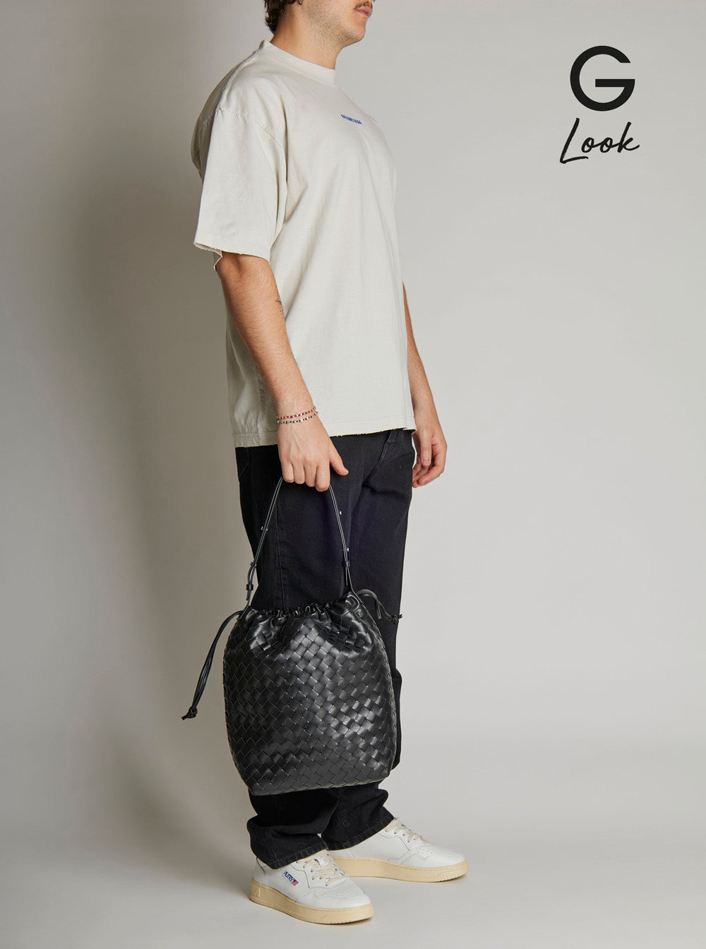 Bottega Veneta Men Black Shoulder Bag With Drawstring Closure And Intrecciato Motif In Leather Man