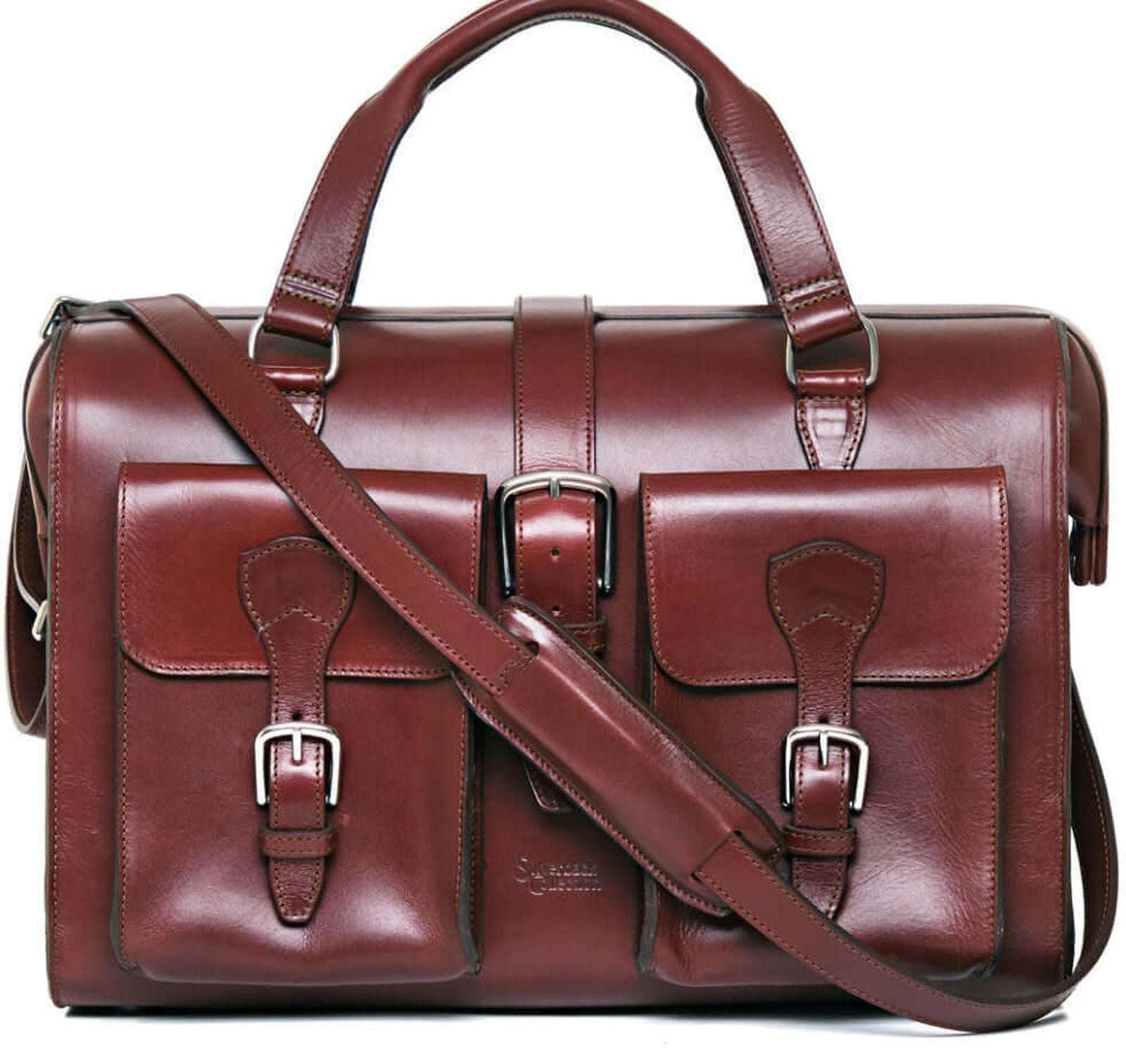 Brown leather satchel bag with shoulder strap on a white background