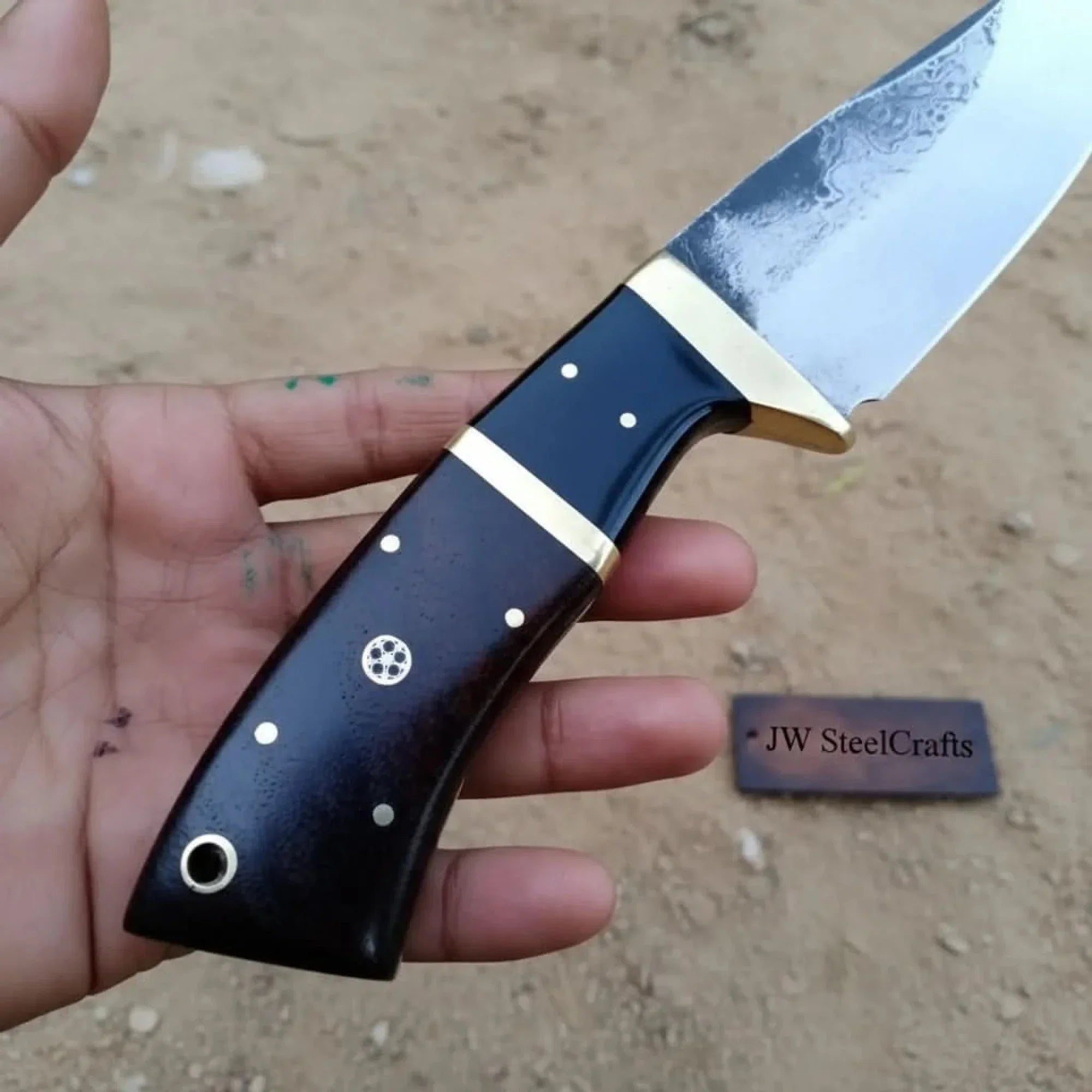 Gut hook knife with wood and brass handle