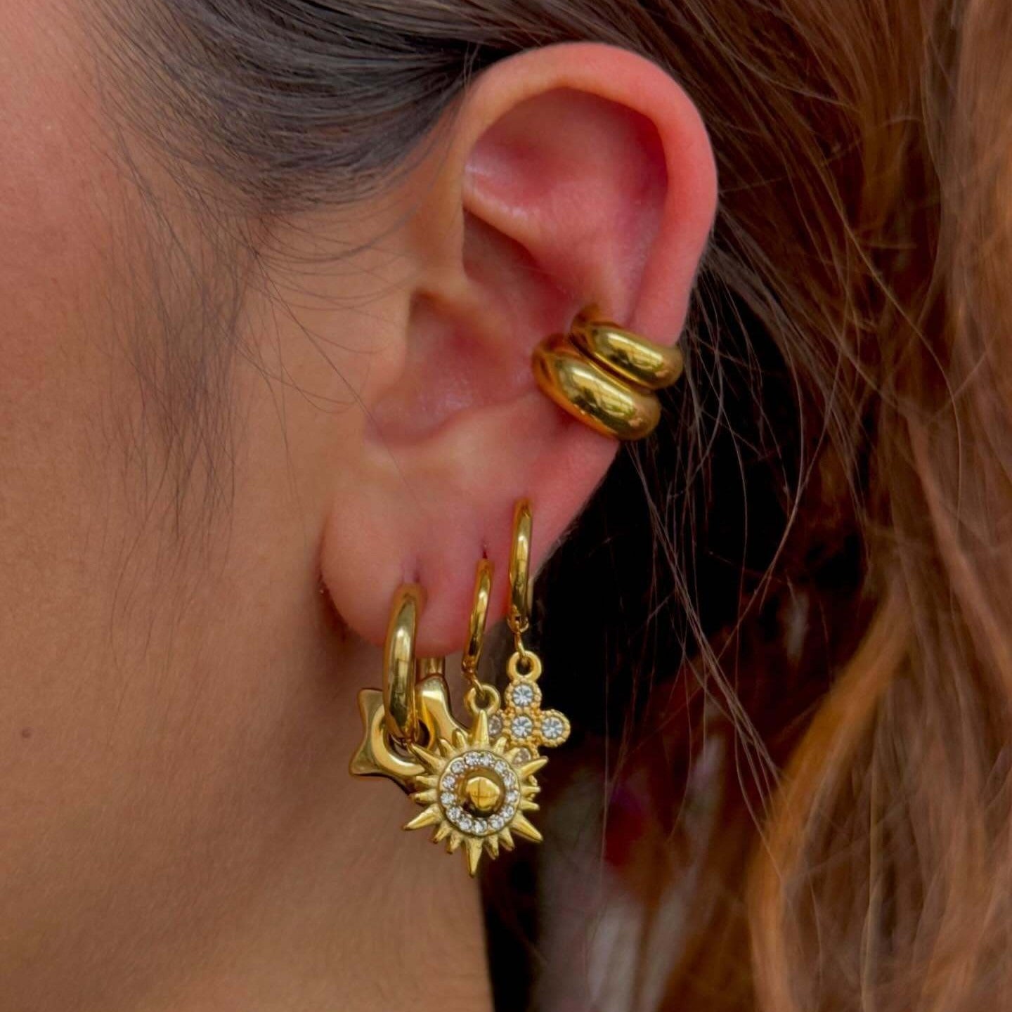 18k gold sun-shaped diamond-studded earrings with unique design