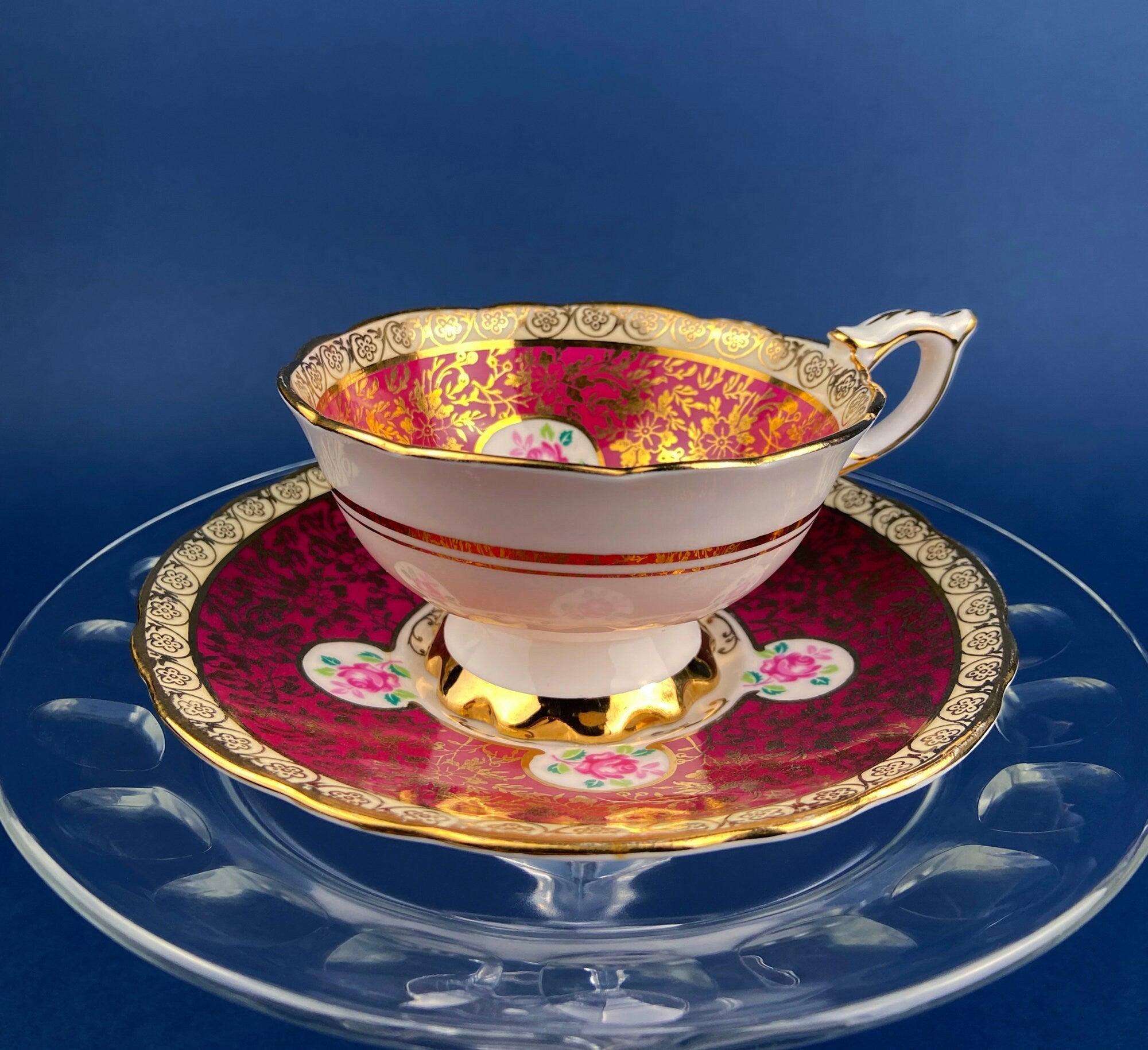 Royal Stafford Cup and Saucer. Black with Gold. Hand Painted Flower Bouquet Inside of Cup and on the Plate.