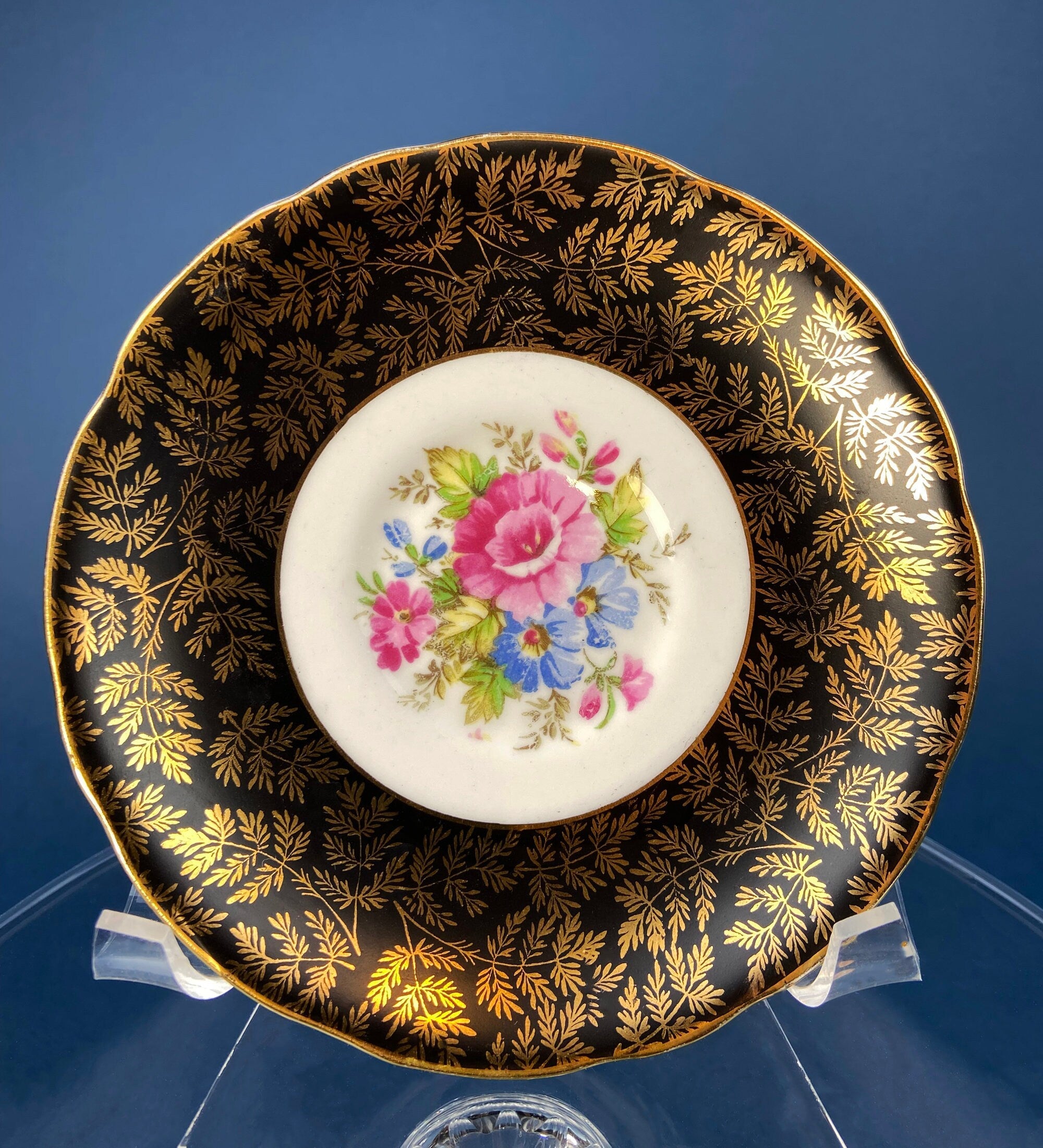 Royal Stafford Cup and Saucer. Black with Gold. Hand Painted Flower Bouquet Inside of Cup and on the Plate.
